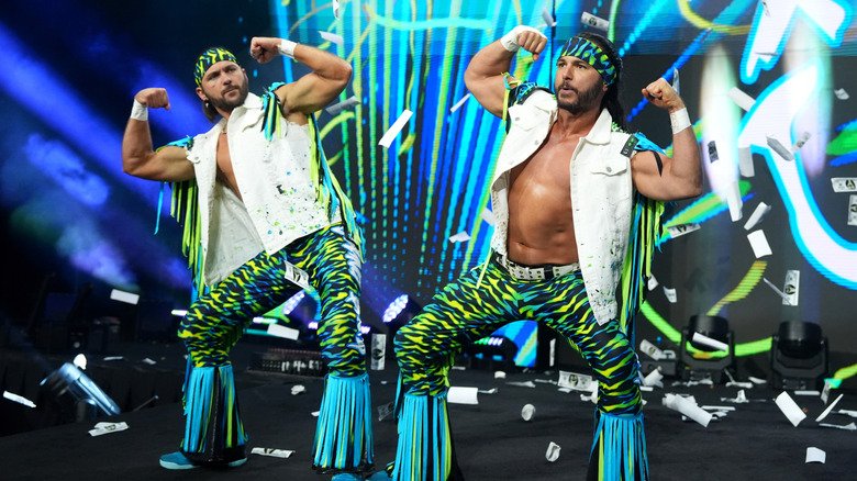The Young Bucks his their signature pose on the ramp before a match on an episode of AEW programming.