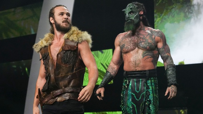 Jack Perry and Luchasaurus walking down the entrance ramp