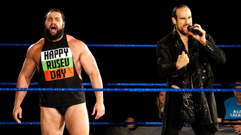 Rusev and Aiden English standing in the ring