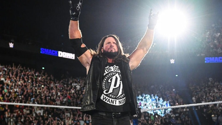 AJ Styles poses in the ring before a promo segment on 