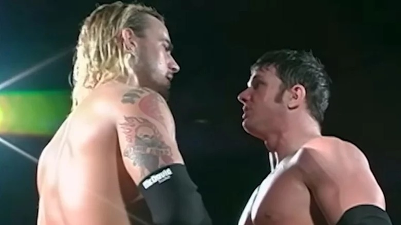 CM Punk and AJ Styles square off.