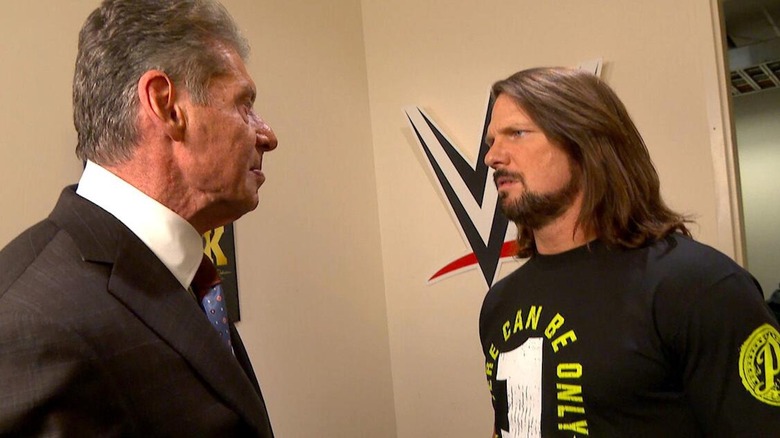 AJ Styles and Vince McMahon bicker backstage.