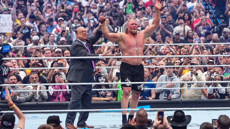 Paul Heyman and Brock Lesnar emotionally wave to the crowd after Lesnar's alleged retirement at WrestleMania 42.