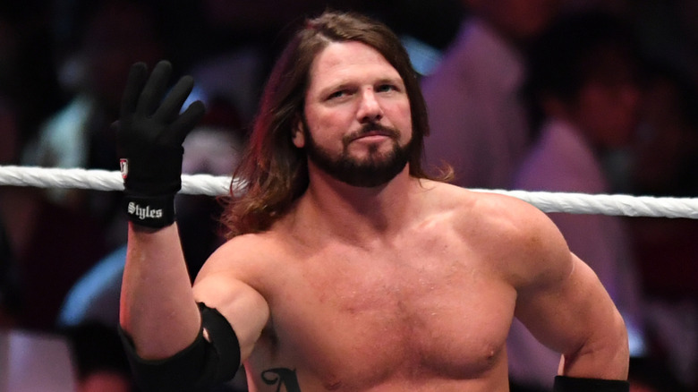 AJ styles doing the you can't see me pose