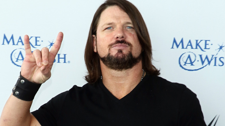 AJ Styles is forming a Too Sweet with his hand