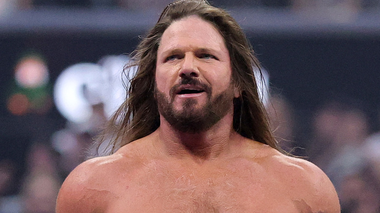 AJ Styles standing in a wrestling ring