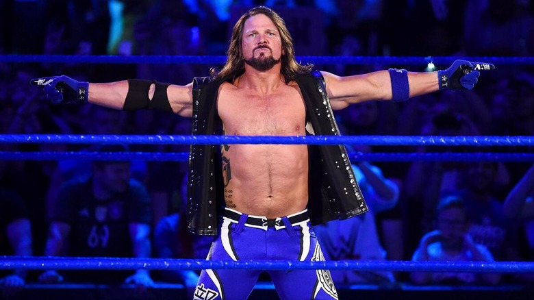 AJ Styles doing his signature pose ahead of a WWE title match against Jinder Mahal on 