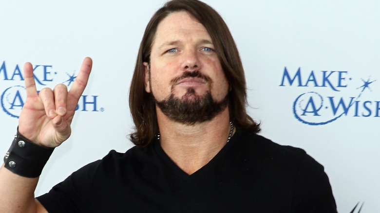 AJ Styles forming a Too Sweet gesture with his hand