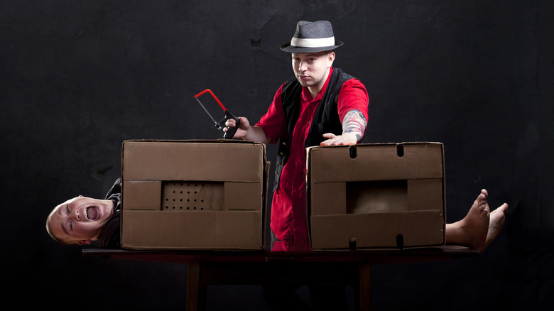 magician sawing woman