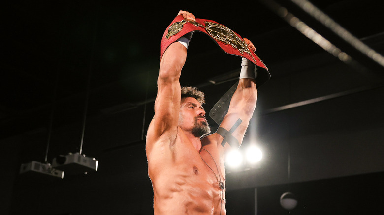 EC3 holding championship belt