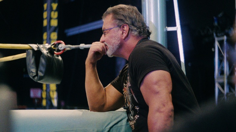 Al Snow watches wrestlers in the ring