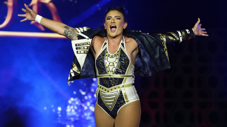 Alex Windsor poses on the stage as she heads down to the ring for a match on "AEW Collision."
