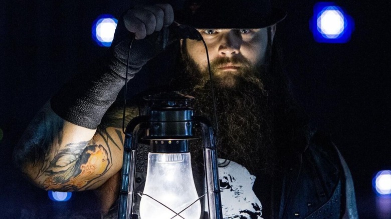 Bray Wyatt heads down to the ring, lantern in hand, before a match on WWE programming.
