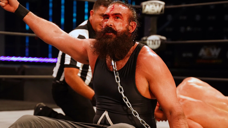 A bloody Brodie Lee battles Cody Rhodes in a dog collar match