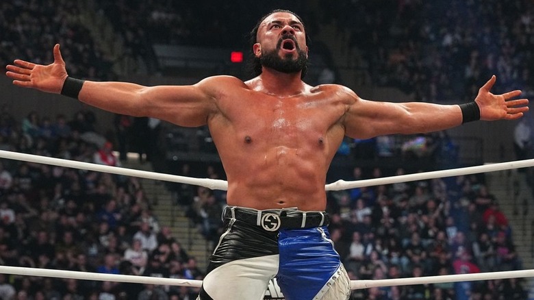 Andrade posing inside the ring 