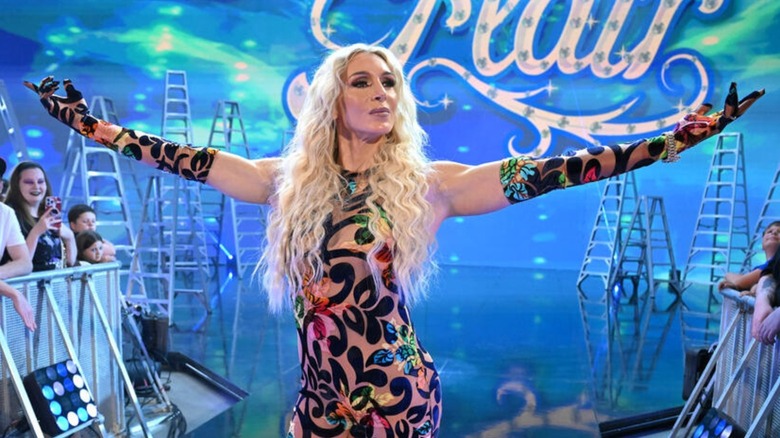 Charlotte Flair poses on the ramp as she heads down to the ring during an episode of WWE TV.