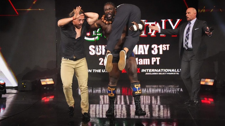 Angel Garza and Berto being dragged from the back by Oba Femi
