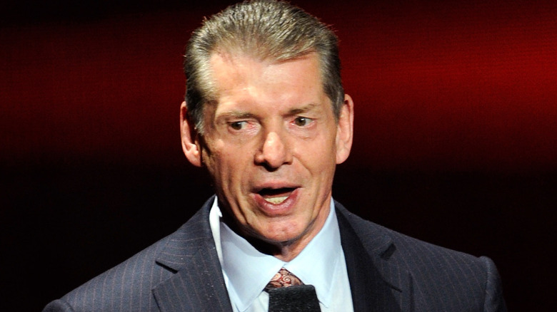 Vince McMahon speaking on the microphone