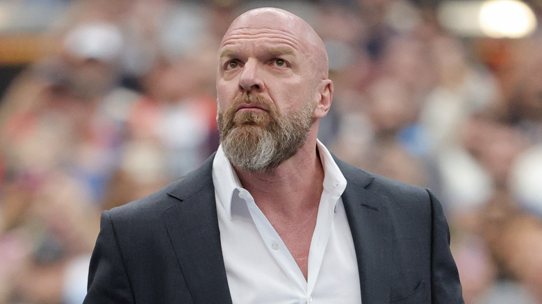 Triple H is wearing a suit
