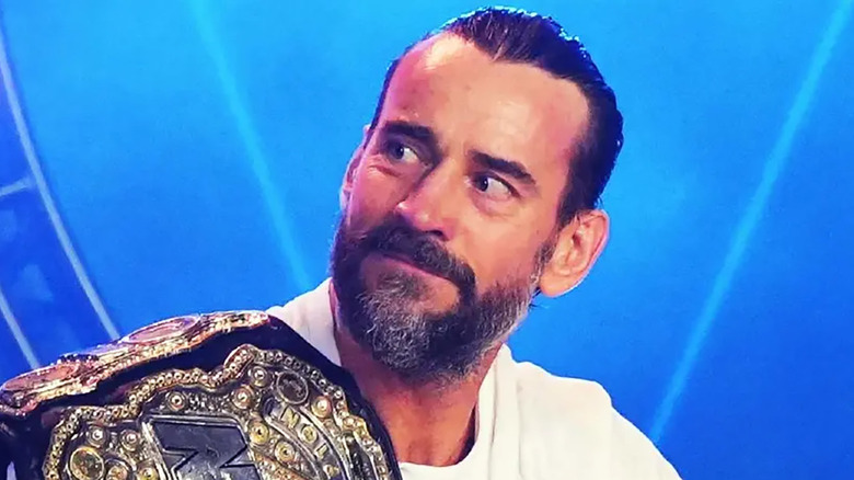 CM Punk AEW belt looking of f to side