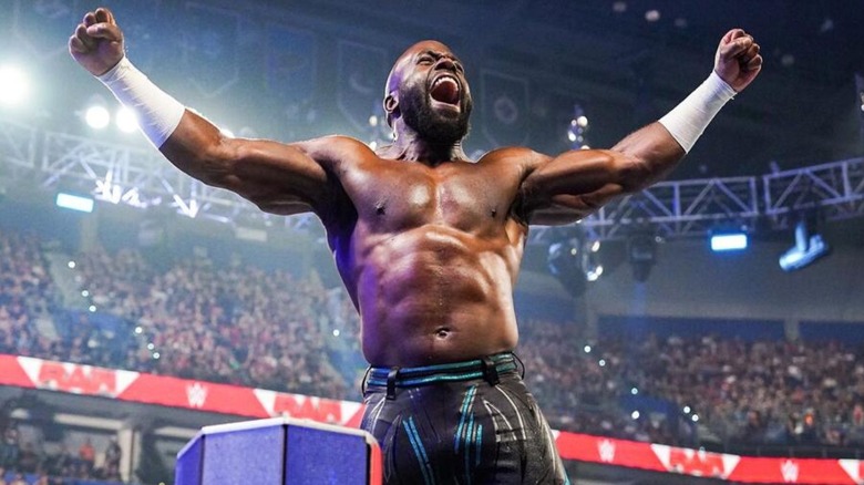 Apollo Crews poses on the ropes before a match on WWE programming.
