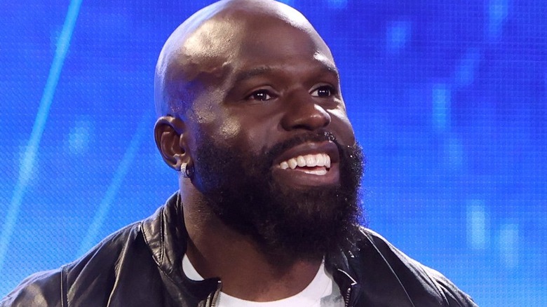 Apollo Crews walks to the ring