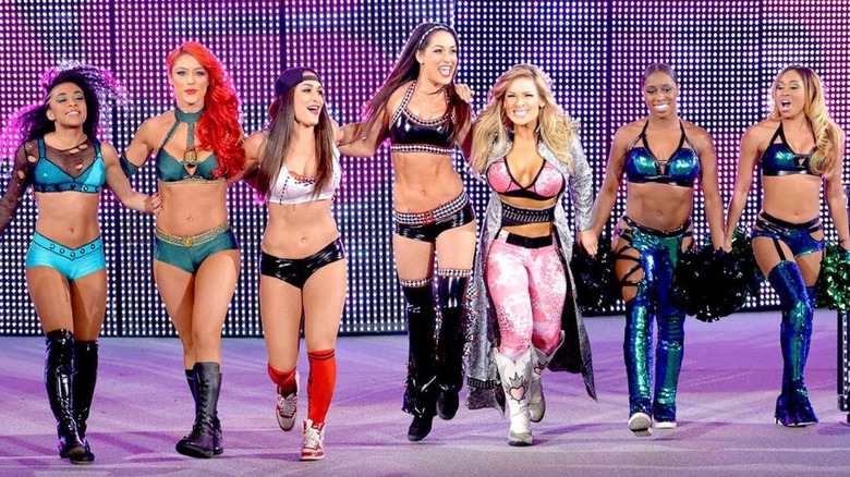 "Team Total Divas" of JoJo, Eva Maria, Nikki and Brie Bella, Natayla, Naomi and Cameron make their way down to the ring for a Survivor Series match.