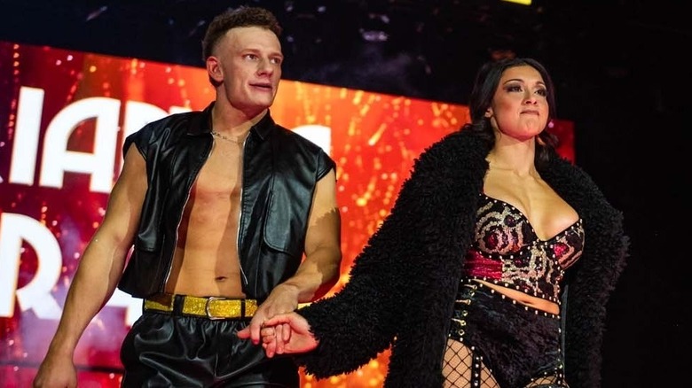 Arianna Grace, accompanied by her fiancé, Channing 