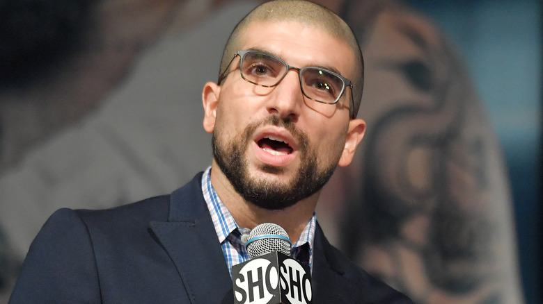 Ariel Helwani speaking into microphone