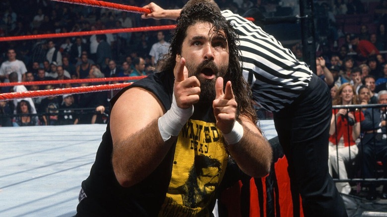 Cactus Jack strikes his trademark "Bang Bang" pose