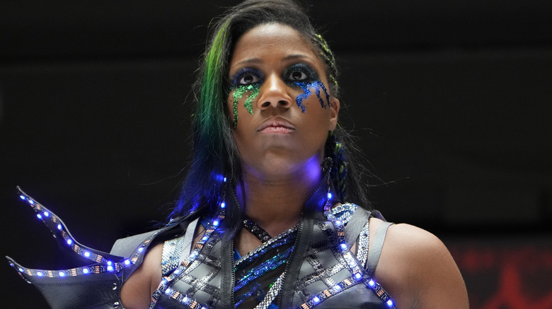 Athena wearing green glitter under her eyes