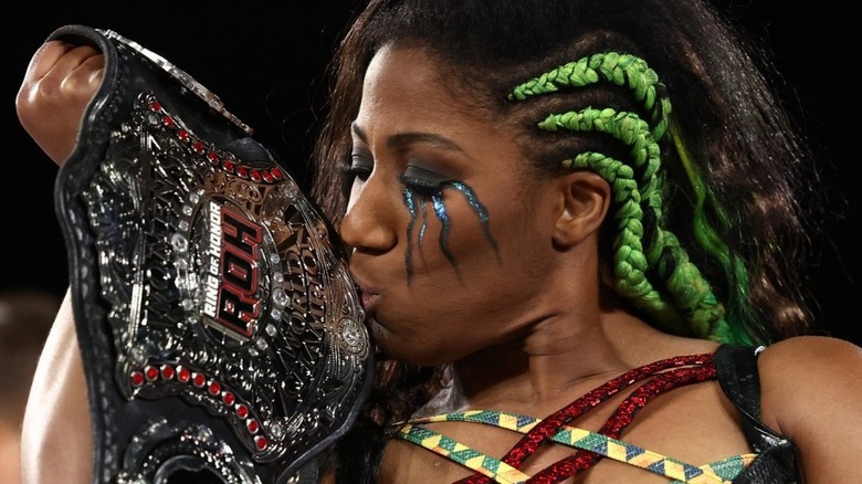 Athena kisses her ROH Women's World Championship, as she proudly remains the champion at 1,253 days
