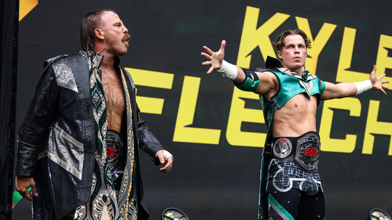 Kyle Fletcher and Mark Davis posing on the entrance stage