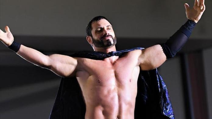 austin-aries-posing-with-a-cape-on