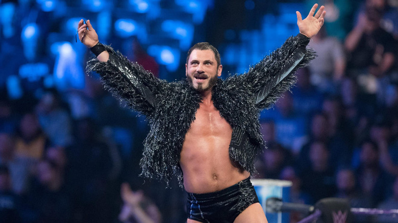 Austin Aries posing in the ring 