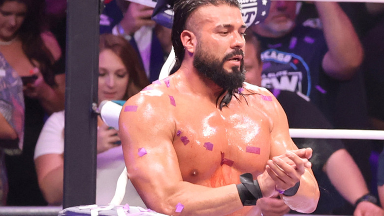 Andrade el idolo standing in the ring