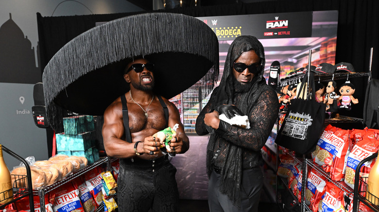 Xavier Woods and Kofi Kingston showing off their fashion sense