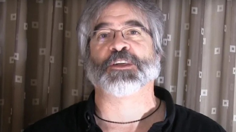 Vince Russo speaks into a camera during an interview for a YouTube series.