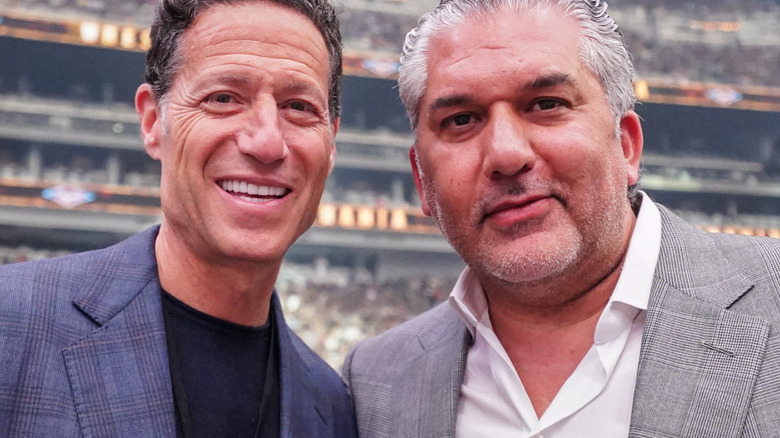 Nick Khan and Mark Shapiro posing at wrestlemania