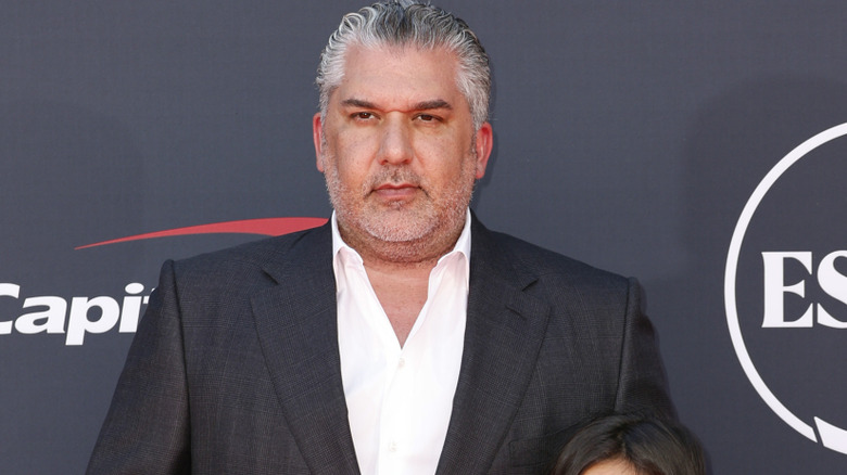 Nick Khan wearing a suit