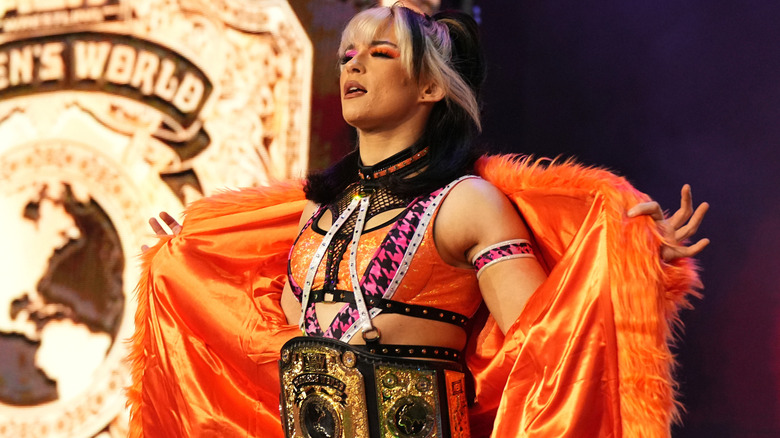 Jamie Hayter wearing orange and black ring gear