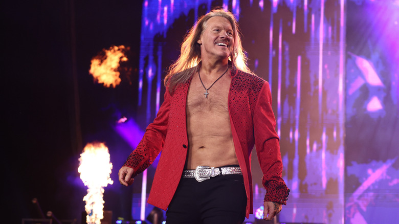 Chris Jericho smiles toward the crowd during his entrance before an in-ring segment on 