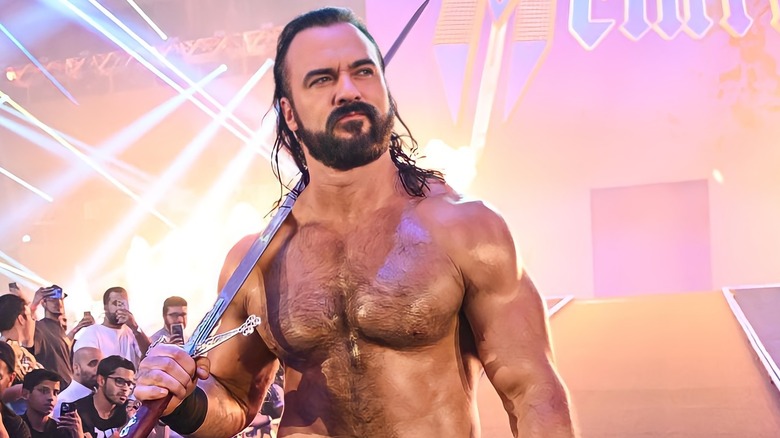 Drew McIntyre carrying a sword