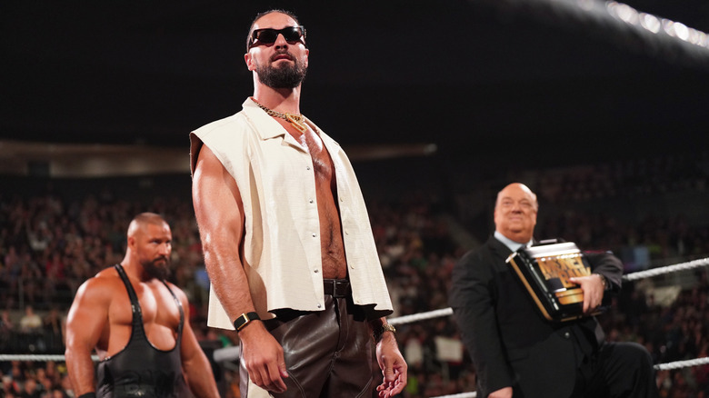 Seth Rollins in the ring with Bron Breakker and Paul Heyman