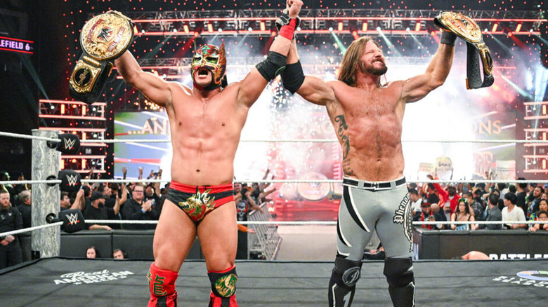 Dragon Lee and AJ Styles celebrating on WWE Raw