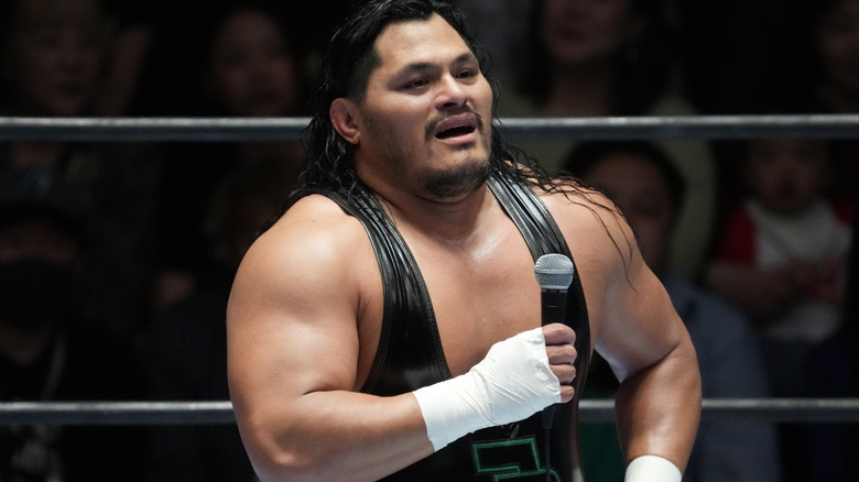 Jeff Cobb holding a microphone