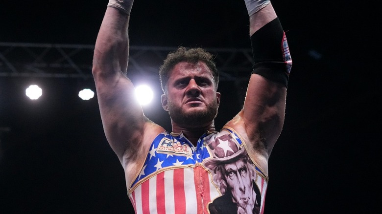 MJF during his match at AEW Grand Slam: Mexico, holding Mistico's mask above his head.