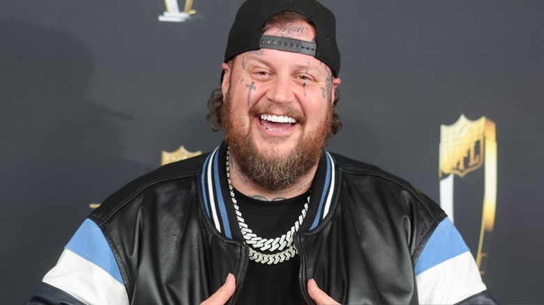 Jelly Roll smiles on the NFL Honors carpet.