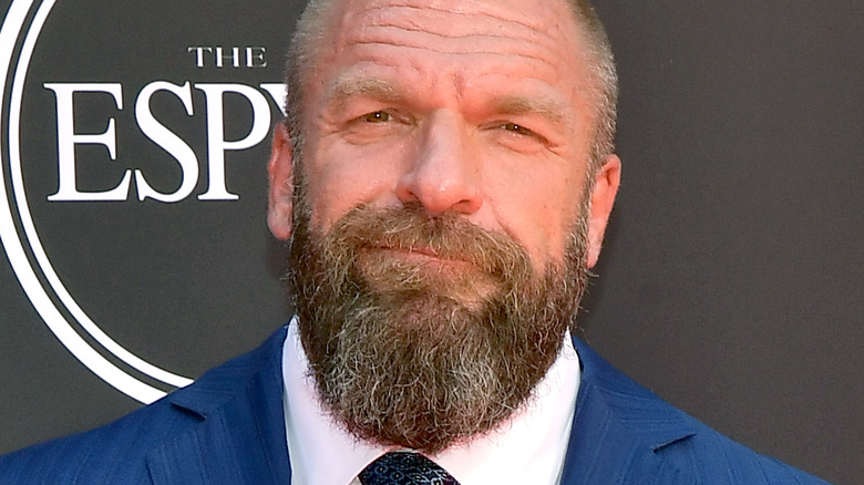 Triple H grinning with a full beard
