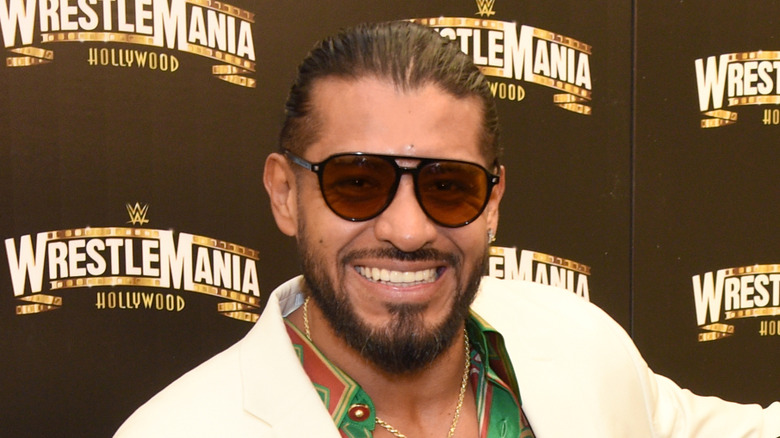 Santos Escobar smiling while wearing sunglasses